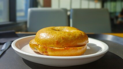 Freshly Baked Bagel Served on a White Plate