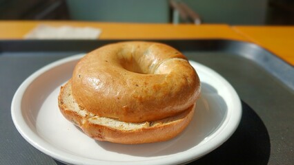 Freshly Baked Bagel Served on a White Plate