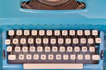Top view of a seventies blue Azerty typewriter