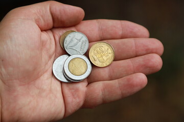 Italian change coins in hand