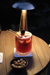 Blueberry cocktail under dim lighting © onur