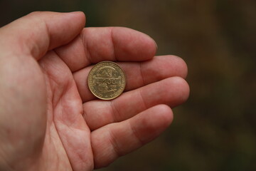 Italian change coin in hand
