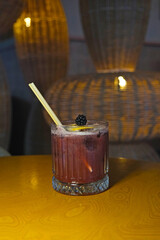 Blueberry cocktail under dim lighting © onur