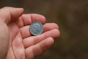 Italian change coin in hand