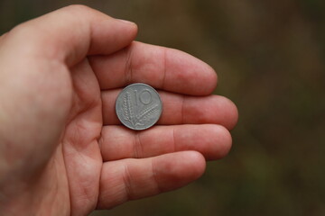 Italian change coin in hand