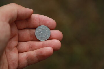 Italian change coin in hand