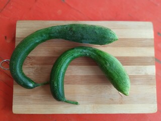 a cucumber of an unusual shape grew in the yard