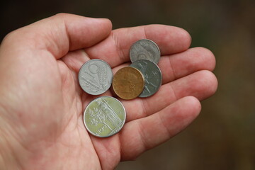 Italian change coins in hand