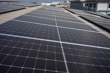 Solar panel at rooftop of factory.