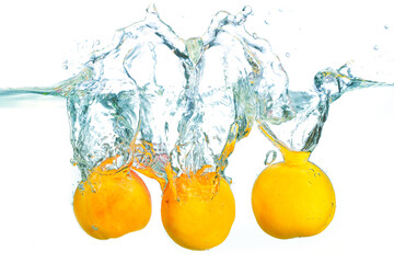 Fresh Apricots Splashing in Crystal Clear Water
