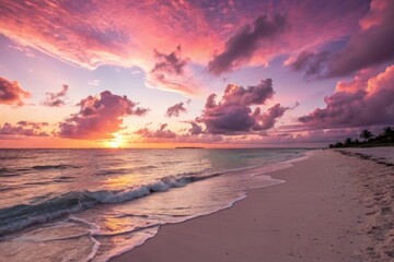 Obraz premium Pink sunset over tropical beach and ocean
