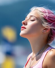 Young woman with pink hair enjoys a sunny day outdoors with her eyes closed
