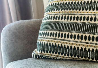 Decorative pillow resting on cozy sofa, enhancing home interior with stylish design and comfortable...