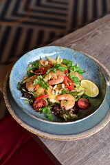 Spicy salad with prawns and vegetables, Thai food.