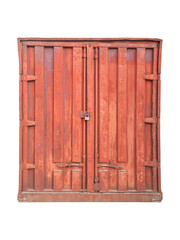 Old red cargo container with visible rust and lock is isolated.