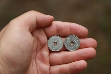 Danish change coins in hand