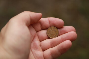 Danish change coin in hand