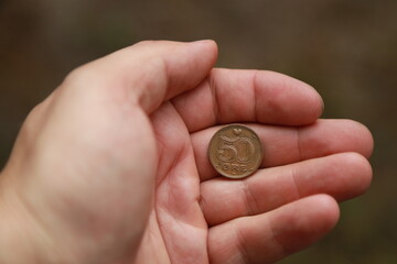 Danish change coin in hand