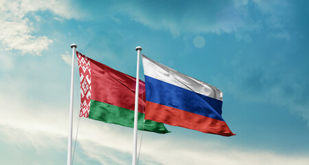 Belarus and Russia friendship flags are waving in the sky. Double country Flag waving with mast. Belarus Russia national flag for agreement.