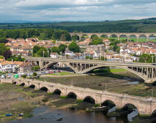 Naklejka premium Aerial view of Berwick‑upon‑Tweed historic bridges spanning the River Tweed in Northumberland, England