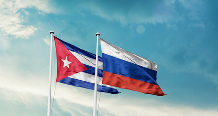 Cuba and Russia friendship flags are waving in the sky. Double country Flag waving with mast. Cuba Russia national flag for agreement.