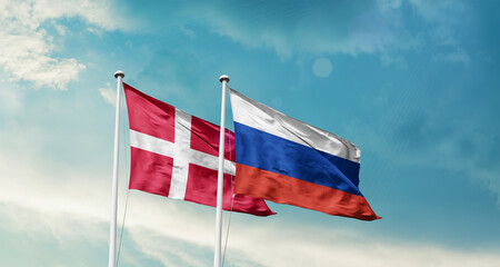 Denmark and Russia friendship flags are waving in the sky. Double country Flag waving with mast. Denmark Russia national flag for agreement.