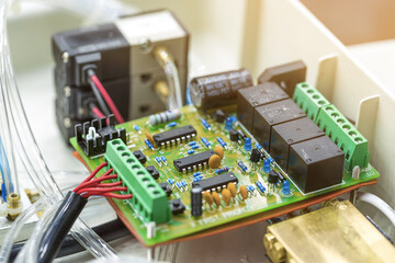 Integrated semiconductor microchip/ microprocessor on green circuit board representative of the...