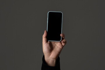 Close-Up of Hand Holding a Smartphone in Minimalist Style