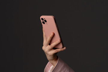 Close-up of Hand Holding Modern Smartphone with Pink Case