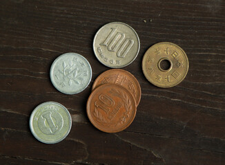 Japanese coins on a wooden table