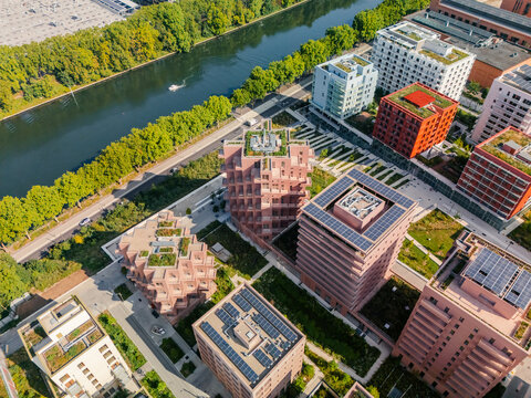 Aerial view of the The Paris 2024 Olympic and Paralympic Village with green roofs and solar panels contrasting against the river, Village des Athl&Atilde;&uml;tes Olympiques, &Atilde;Žle-de-France, France.