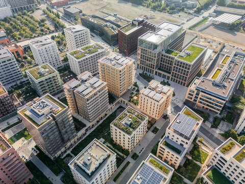 Aerial view of the The Paris 2024 Olympic and Paralympic Village casting shadows and reflecting sunlight with rooftop gardens, Village des Athl&Atilde;&uml;tes Olympiques, &Atilde;Žle-de-France, France.