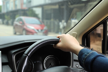 Turn on the radio in the car.