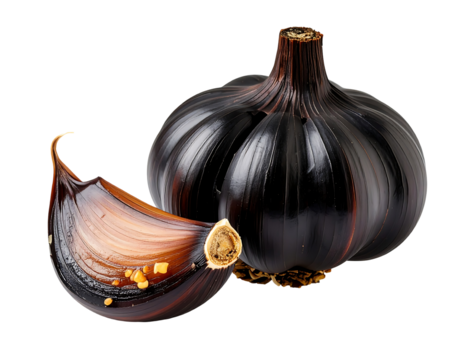 Close up of a whole head of black garlic and a single clove separated, against a black background. The garlic is dark purplish-black, with visible texture and details on the cloves. The single