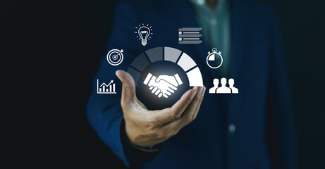 A business professional holds a virtual handshake icon surrounded by digital symbols representing teamwork, ideas, targets, time management, and growth.