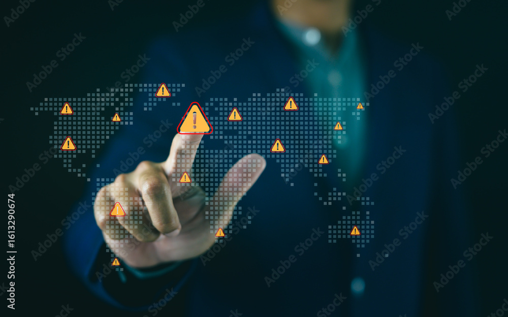 Poster a person points at a digital world map with multiple warning icons, symbolizing global alerts or cyb