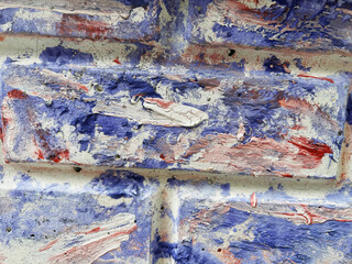 Textured Wall Surface with Blue and Red Patterns Ideal for Background or Art Projects