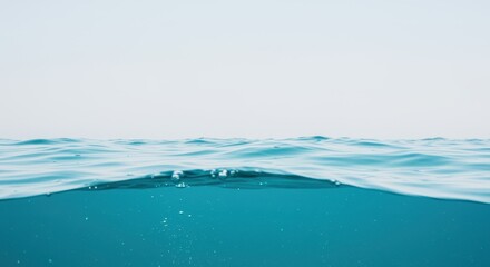 Serene Teal Ocean Surface: Underwater and Above Water View, Calm Water, Minimalist Style