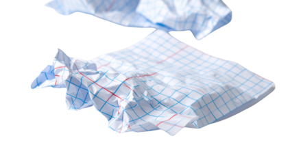  Crumpled paper lies on surface showcasing blue grid pattern with red accents creating visually appealing texture white background