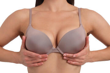 Woman wearing beautiful beige bra on white background, closeup