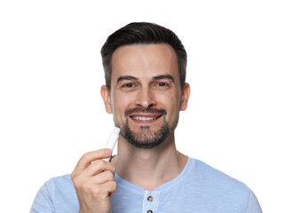 Smiling man with lip balm on white background