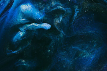 Abstract colorful smoke background. Moving flow of dark blue paints, fluid art