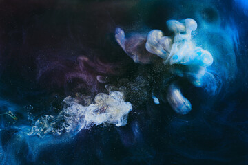 Abstract colorful smoke background. Moving flow of blue paints, fluid art