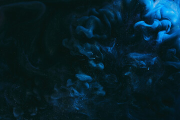 Abstract colorful smoke background. Moving flow of blue paints, fluid art