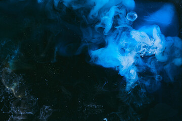 Abstract colorful smoke background. Moving flow of blue paints, fluid art