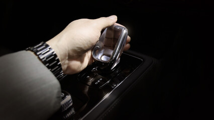 EV Car gear. Close up of modern automatic car gear shifters in luxury vehicle interiors. Feature sleek ergonomic designs and advanced car transmission controls for premium driving experience. EV gear