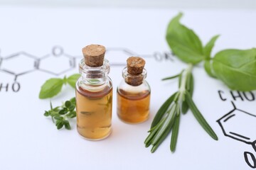 Different herbs and bottles of cosmetic products on paper with chemical formulas, closeup