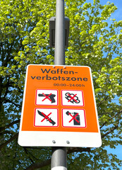 Waffenverbotszone in german, warning sign explicitly prohibiting weapons, No weapons policy, Public...