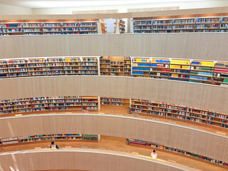 Zurich, Switzerland - July 2025: Interior of University Law Library with curved wooden ceiling and...