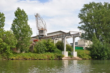 Riverside Industrial Site with Concrete Gantry and Loading Crane